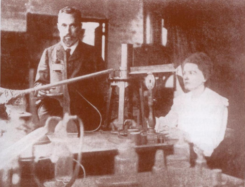 Maria Skłodowska-Curie i Piotr Curie         przy pracy